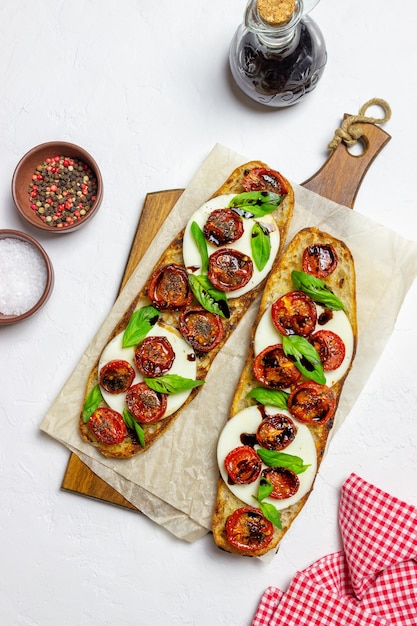 Bruschetta caprese with mozzarella, tomatoes and basil.