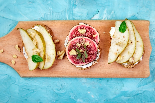 Bruschetta and Crostini with pear, ricotta cheese, honey, figs