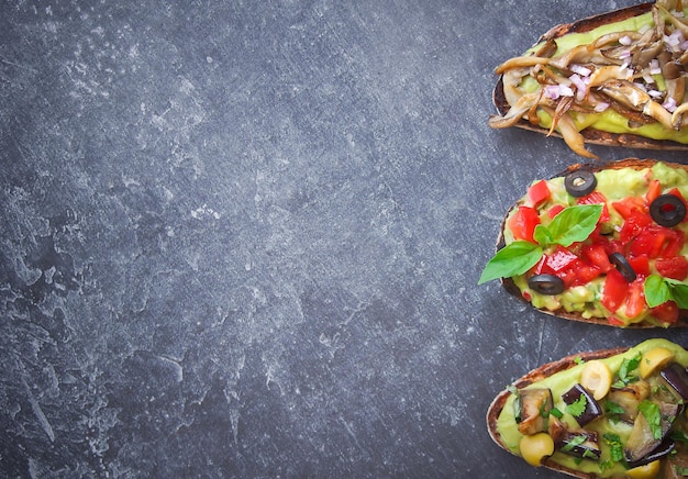 Bruschetta on a dark back, Assorted bruschetta, Top view