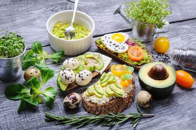 Bruschetta with avocado microgrin, quail eggs and Adyghe cheese and mozzarella