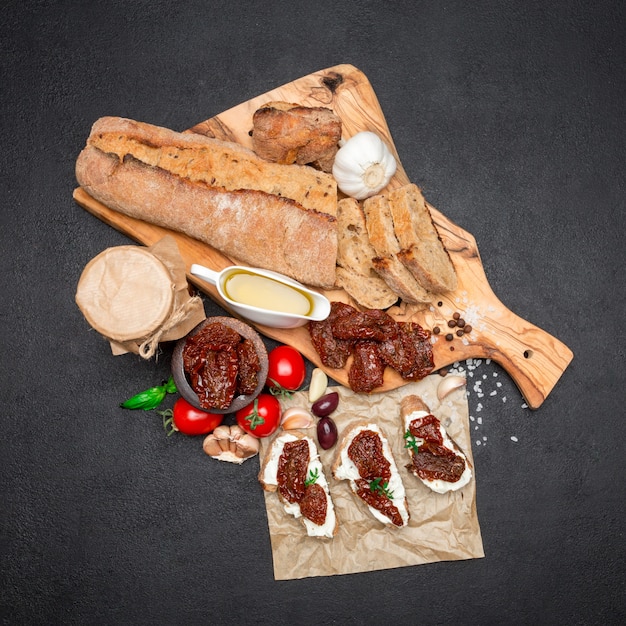 Bruschetta with Canned Sundried or dried tomato halves on craft pepper