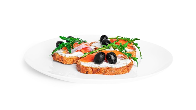 Bruschetta with cream cheese, salmon and vegetables isolated. Toast isolated. Sandwich isolated. Sandwich with salmon and cheese