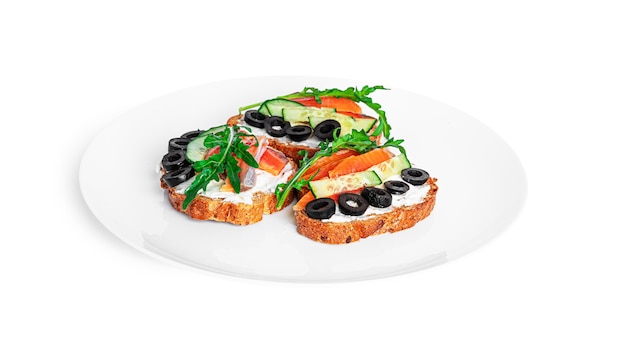 Bruschetta with cream cheese, salmon and vegetables isolated. Toast isolated. Sandwich isolated. Sandwich with salmon and cheese