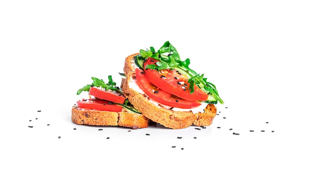 Bruschetta with cream cheese and vegetables isolated. Toasts isolated. Sandwich isolated. Sandwich with vegetables and cheese