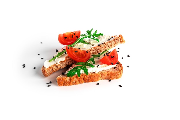 Bruschetta with cream cheese and vegetables isolated on a white background Toasts and coffee isolated Sandwich isolated Sandwich with vegetables and cheese High quality photo