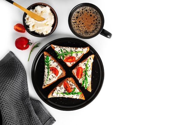 Bruschetta with cream cheese and vegetables isolated on a white background Toasts and coffee isolated Sandwich isolated Sandwich with vegetables and cheese High quality photo