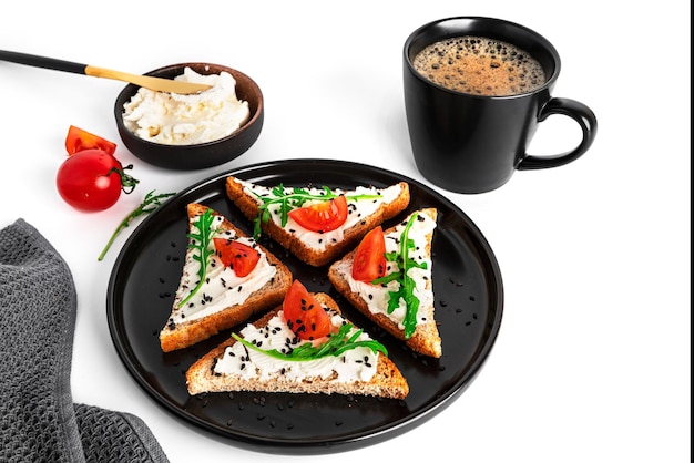 Bruschetta with cream cheese and vegetables isolated on a white background Toasts and coffee isolated Sandwich isolated Sandwich with vegetables and cheese High quality photo