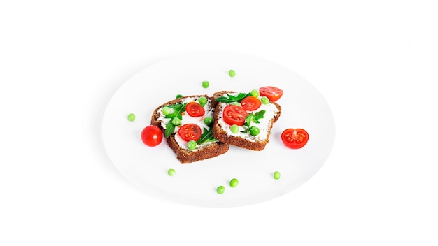 Bruschetta with cream cheese and vegetables isolated on a white background. Toasts isolated. Sandwich isolated. Sandwich with vegetables and cheese. High quality photo