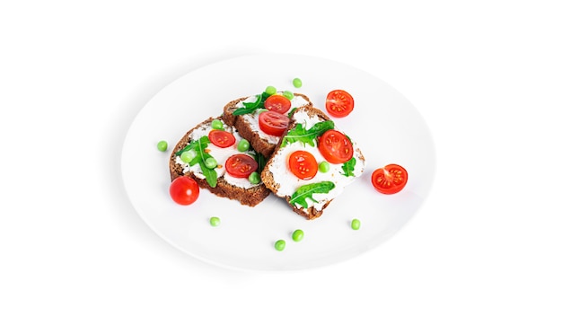 Bruschetta with cream cheese and vegetables isolated on a white background. Toasts isolated. Sandwich isolated. Sandwich with vegetables and cheese. High quality photo