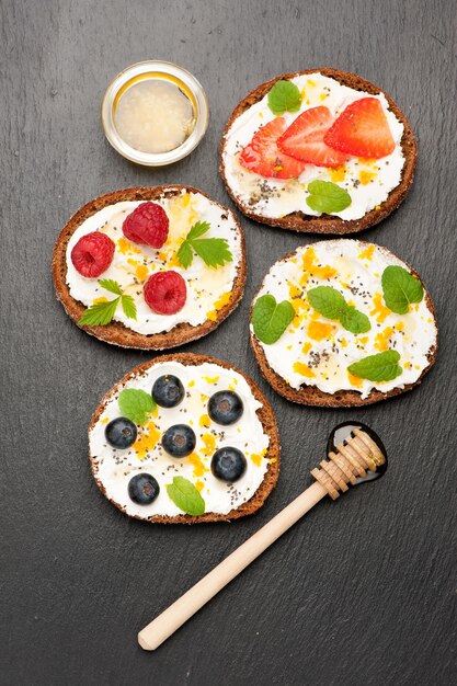 Bruschetta with goat cheese honey and fresh berries top view