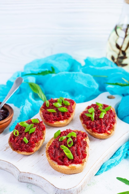 Bruschetta with grated beetroot herbs and caramelized onion