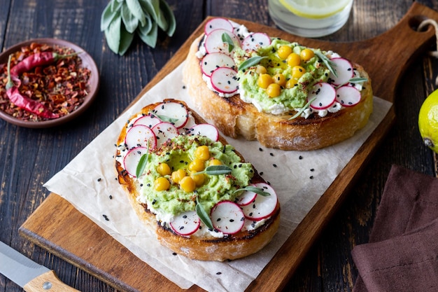 Bruschetta with guacamole radish white cheese chickpeas and sage Vegetarian food Sandwich Italian food