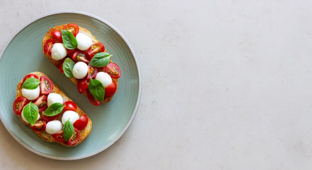 Bruschetta with mozzarella tomatoes and basil Vegetarian food Healthy eating