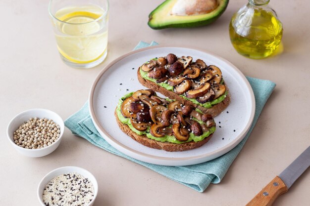 Bruschetta with mushrooms and avocados. Healthy eating. Vegetarian food. Keto diet.