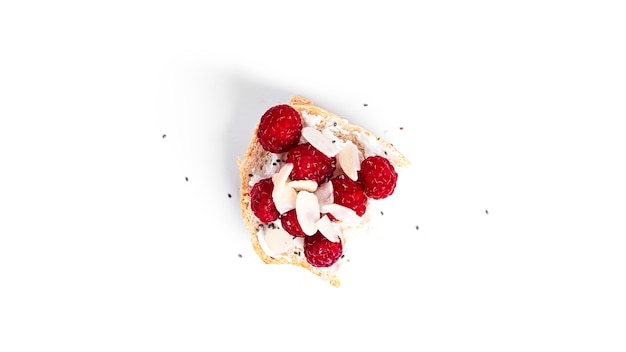 Bruschettas with cottage cheese and raspberries isolated