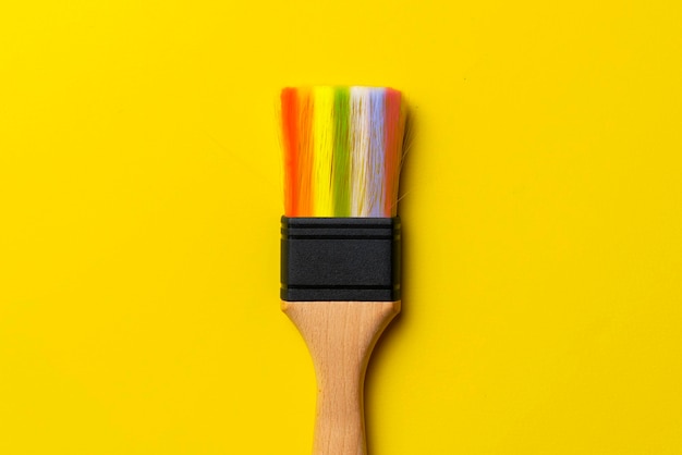 A brush drawing a rainbow abstract creative simple idea