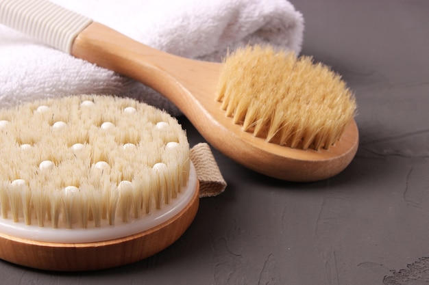 Brush for dry massage on a colored background top view