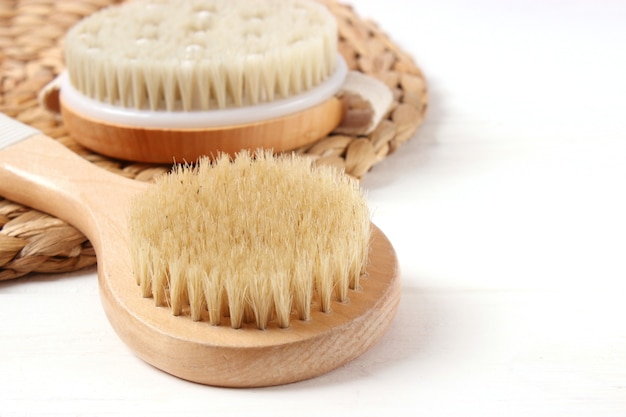 Brush for dry massage on a colored background top view