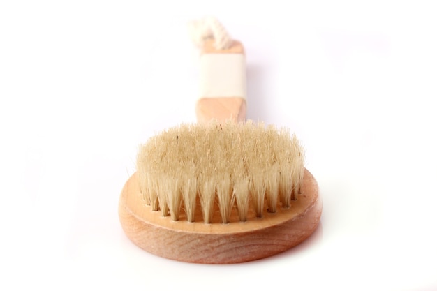 Brush for dry massage on a white background isolated