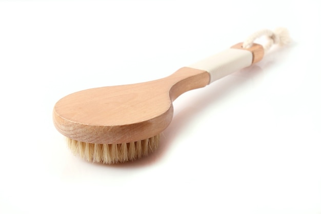 Brush for dry massage on a white background isolated