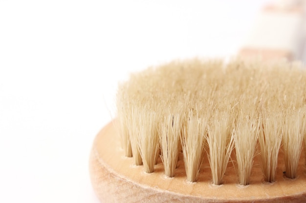 Brush for dry massage on a white background isolated