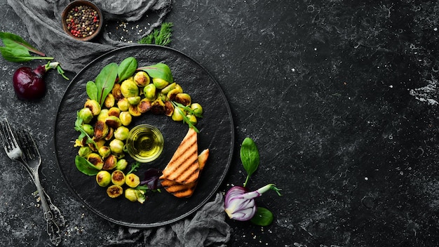 Brussels sprouts fried with sauce and toast bread Rustic style Top view Free space for your text