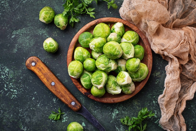 Brussels sprouts on green concrete background