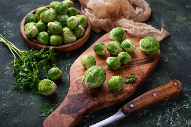 Brussels sprouts on green concrete background