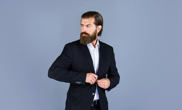 Brutal businessman with perfect beard and moustache real boss in jacket mature man has serious look confidence and charisma handsome man wear office suit male beauty and fashion