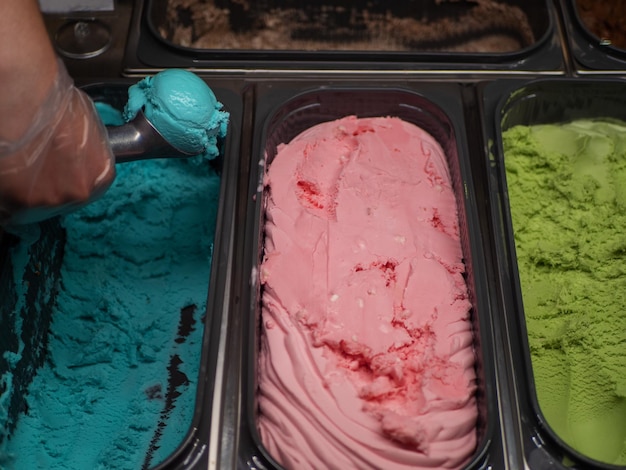 Bubble gum ice cream scoop ball serving icecream Three types of ice cream in steel trays