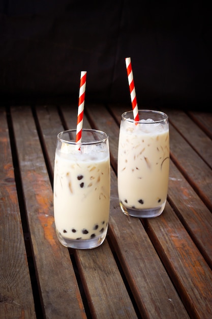 Bubble milk tea in glass. Trendy beverage in Asia. Sweet drink with tapioca.