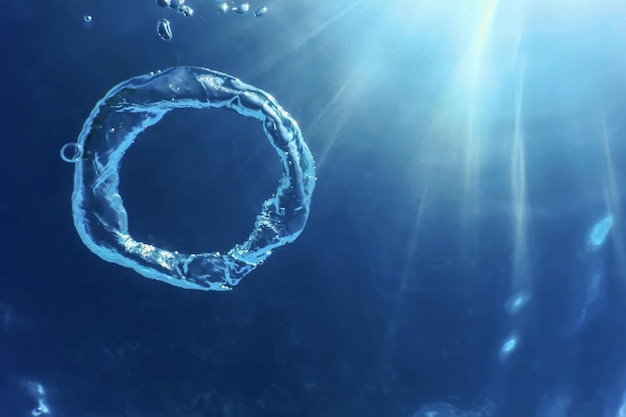 Bubble Ring Ascends towards the Sun, Underwater