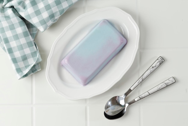 Bubblegum Pudding on White Plate Homemade Soft Silky Pudding with Blue Color