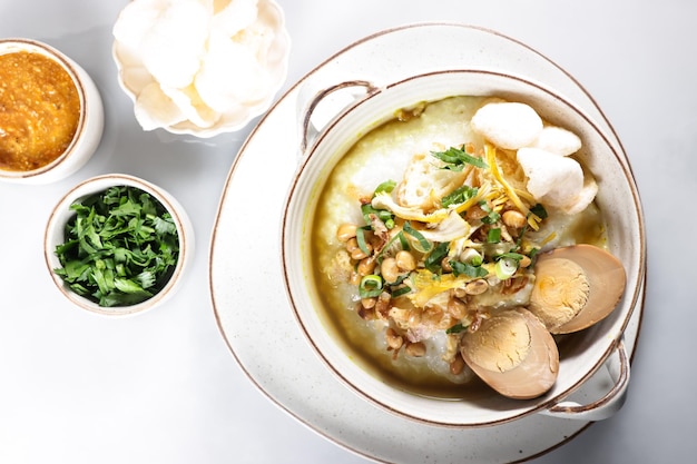 Bubur Ayam or Indonesian Rice Porridge with Shredded Chicken and Cakwe.