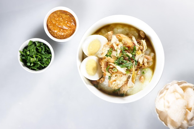 Bubur Ayam or Indonesian Rice Porridge with Shredded Chicken and Cakwe.