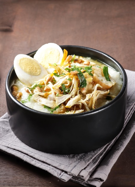 Bubur Ayam or Indonesian Rice Porridge with Shredded Chicken and Cakwe.