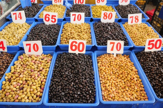 Buckets of olives for sale street food market