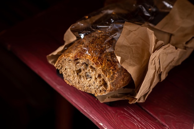 Buckwheat baguette Sliced baguette made from dark coarse flour Dark background