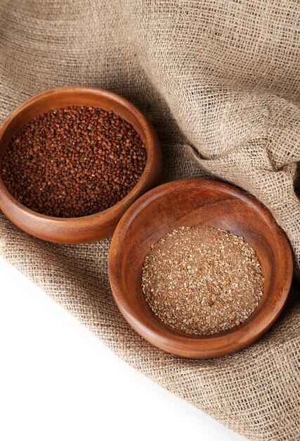 Buckwheat and flour in bowls closeup