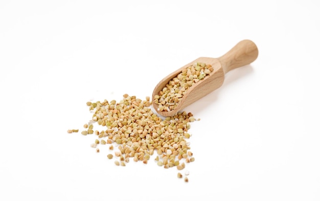 Buckwheat groats in bowls and bags isolated on a white background High quality photo