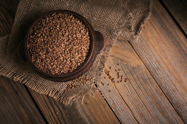 Buckwheat groats top view. Grains of raw buckwheat as a background texture.