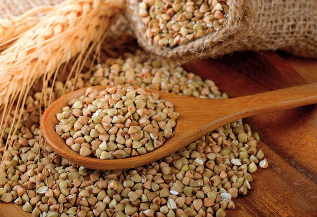 buckwheat groats on wooden surface