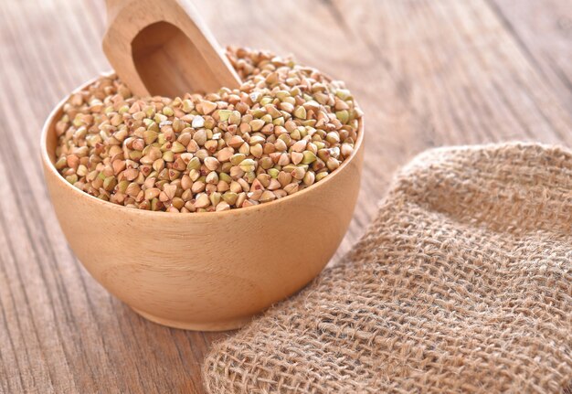 Buckwheat isolated in a wooden bowl