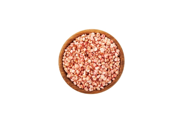 Buckwheat popcorn in wooden bowl top view Dry breakfast air buckwheat popcorn with strawberries.