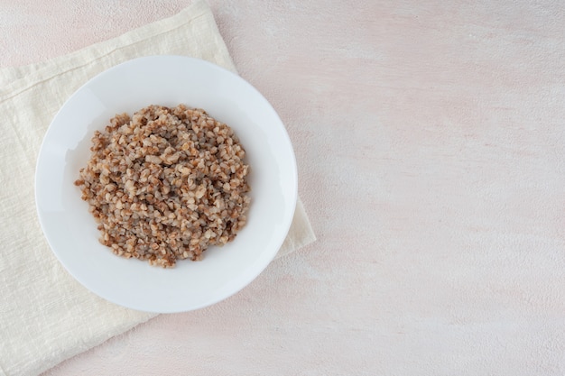 Buckwheat porridge on a white plate