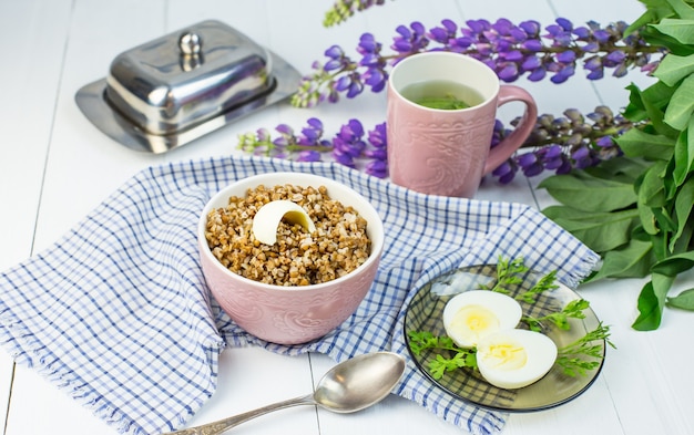 Buckwheat porridge with butter and boiled chicken egg