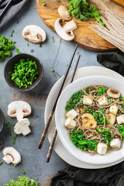 Buckwheat soba noodles tofu soup ingredients for asian chinese japanese korean vietnamese food Top view flat lay kitchen cooking background