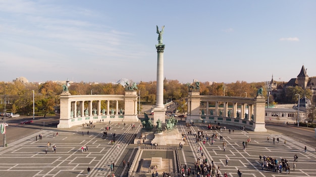 Budapest, Hungary - aerial shot from drone on Angel sculpture from on the top of Heroes' Square and the skyline of Budapest