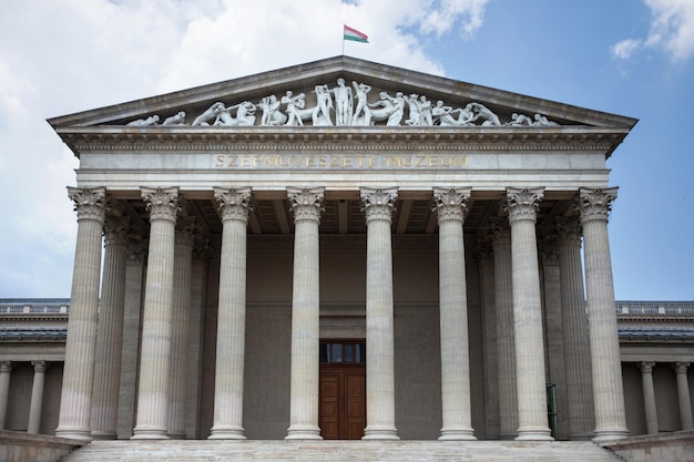 Budapest. Hungary. Museum building with columns on a background of blue sky