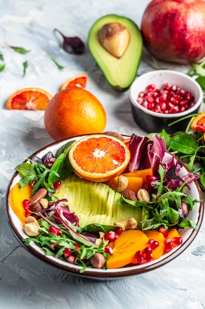 Buddha bowl of mixed vegetable and fruit. Healthy balanced eating. vertical image.